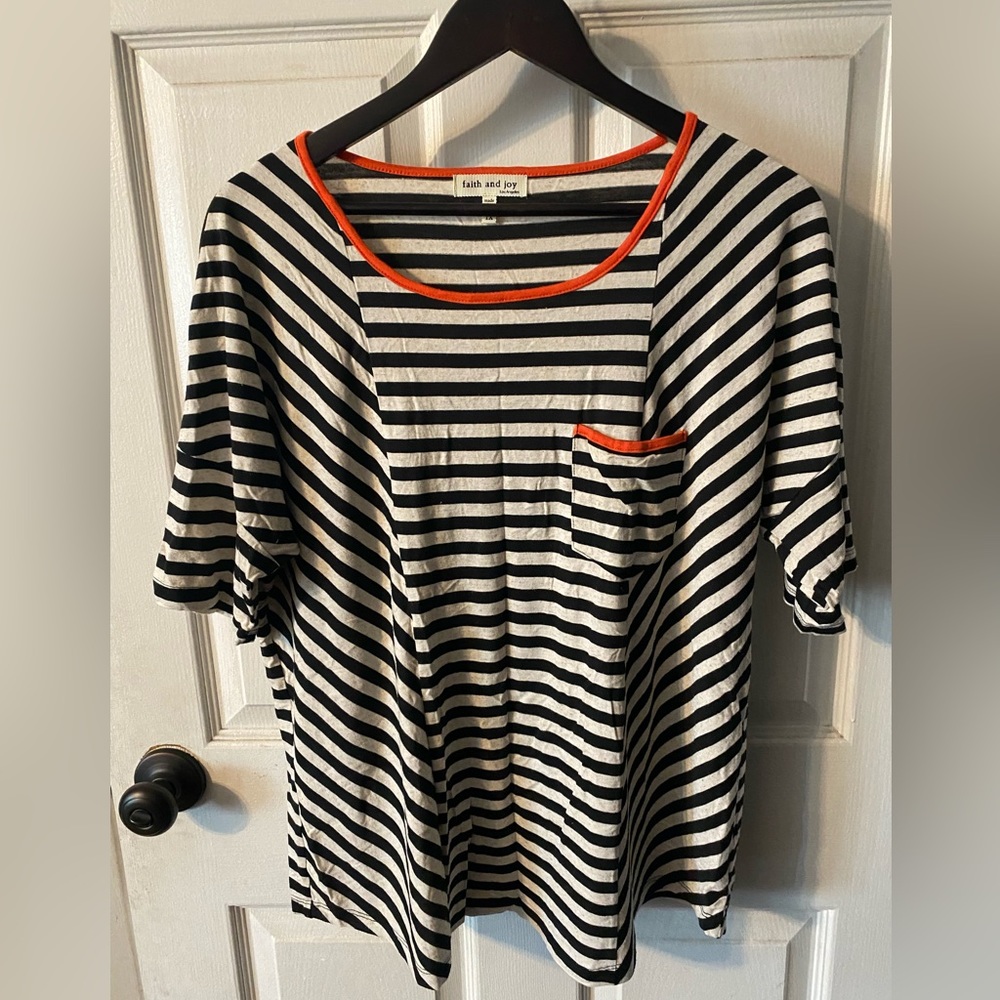 Black and white striped top with orange borders